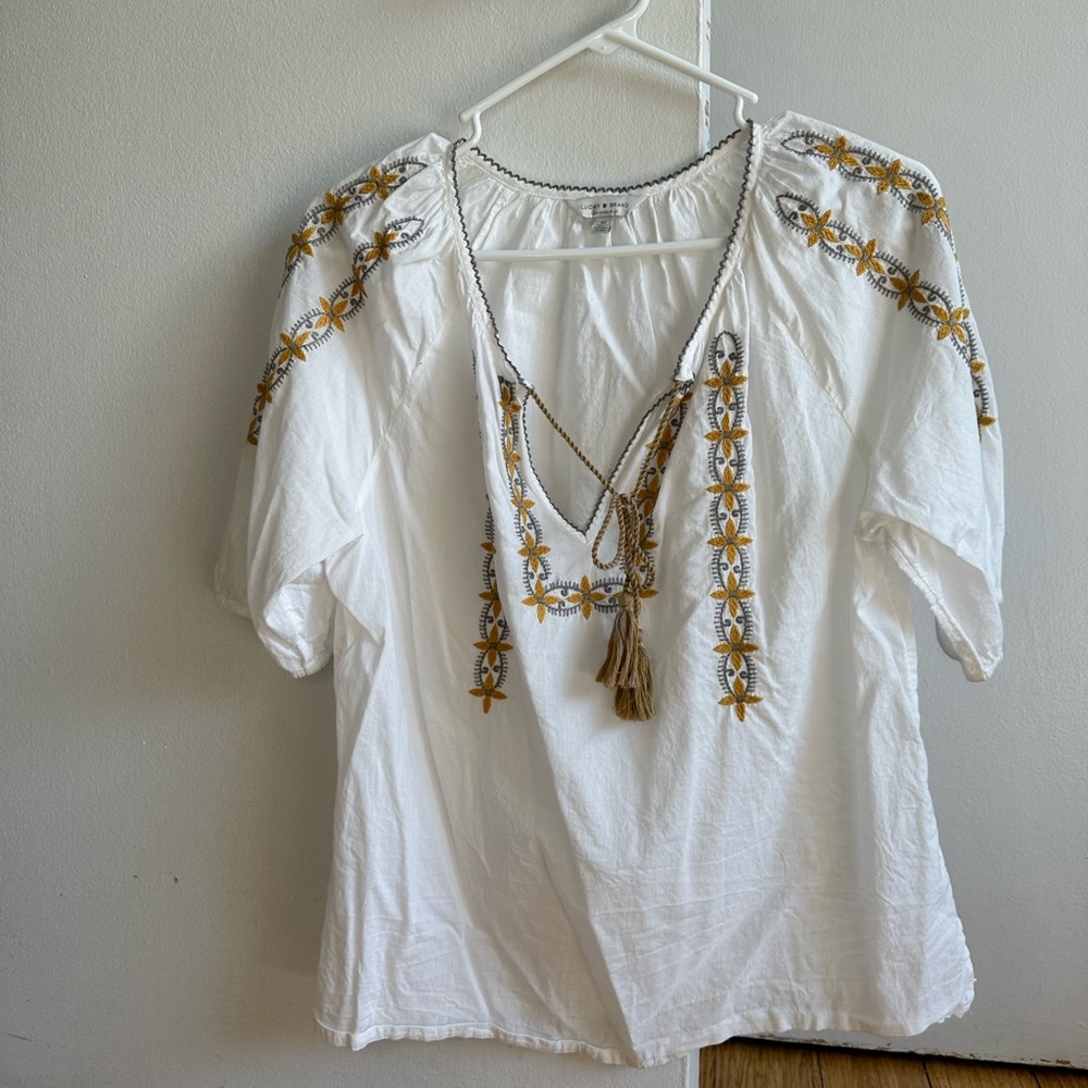 Lucky embroidered shirt.